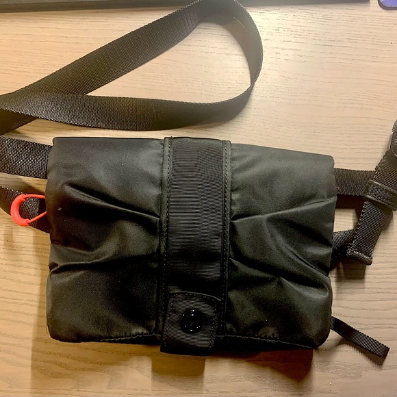 New no tags. Lululemon small Crossbody bag. 4 pockets. Clear phone pocket. - Picture 1 of 5